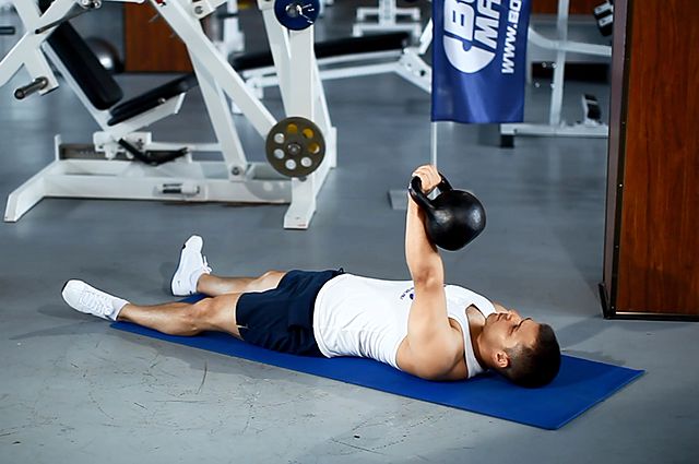 extended range one-arm kettlebell floor press