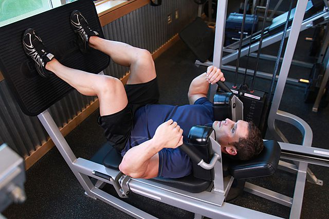 lying machine squat
