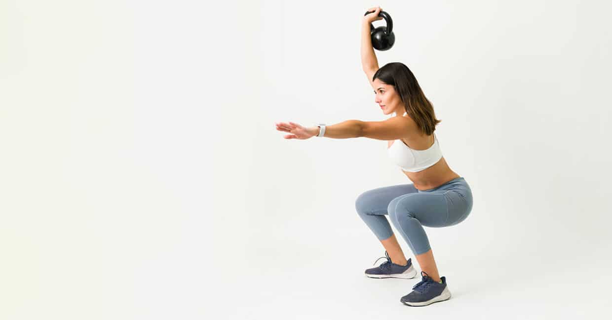 one-arm overhead kettlebell squats