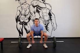 wide stance stiff legs